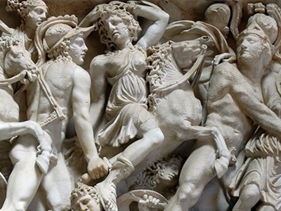 A detailed section of carvings/sculpture depicting a scene of carnage in Rome. Vatican.